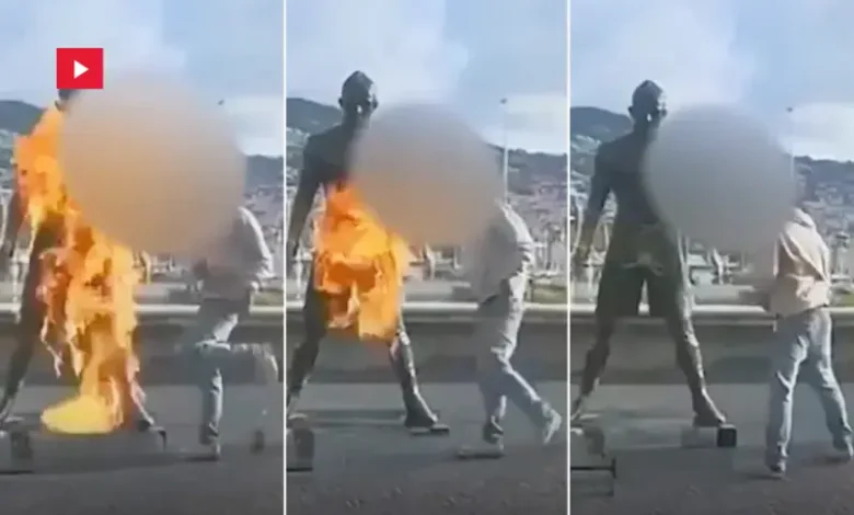 Bizarre moment vandal sets Ronaldo statue on FIRE