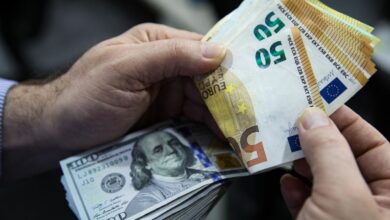 Euro Banknotes And American U.S. Dollar Bills