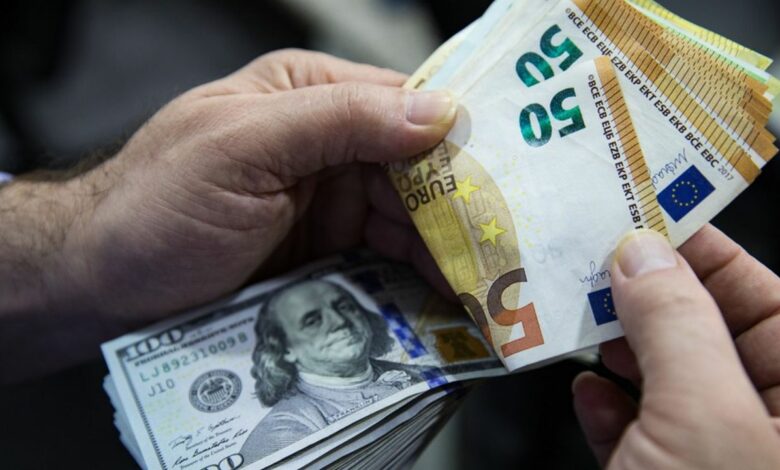 Euro Banknotes And American U.S. Dollar Bills