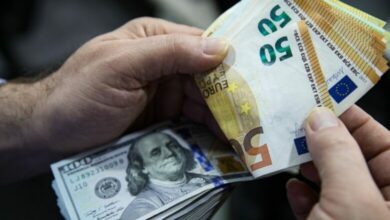 Euro Banknotes And American U.S. Dollar Bills