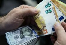 Euro Banknotes And American U.S. Dollar Bills