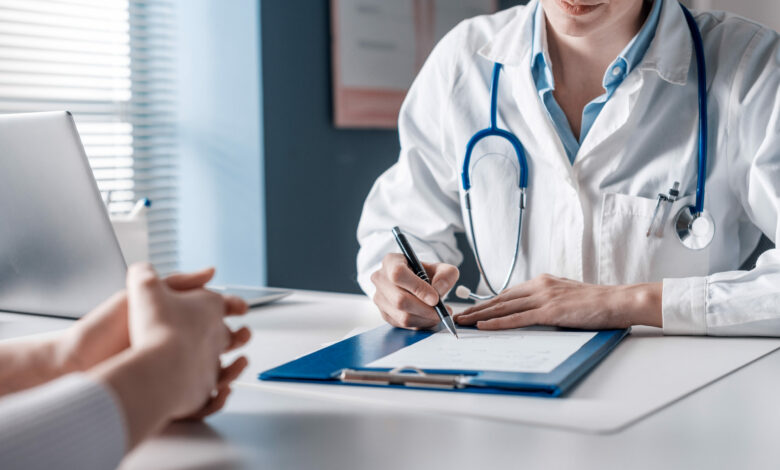 Doctor writing a medical prescription