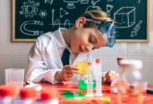 Boy playing with chemistry game